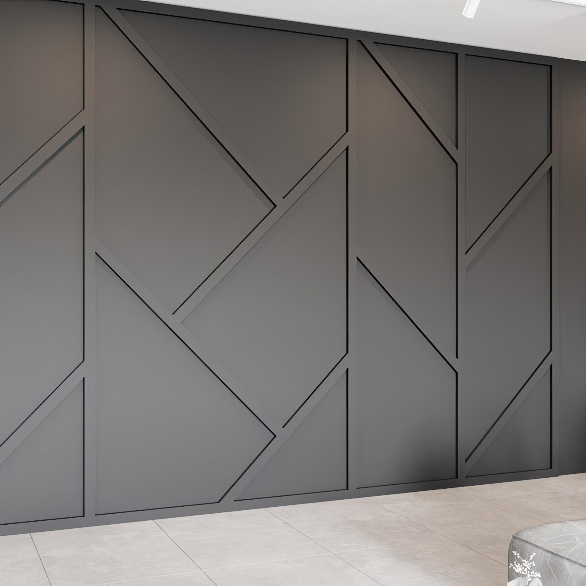Perete decorativ antracit cu profile din poliuretan P851350 dispuse în linii geometrice asimetrice într-un salon modern.