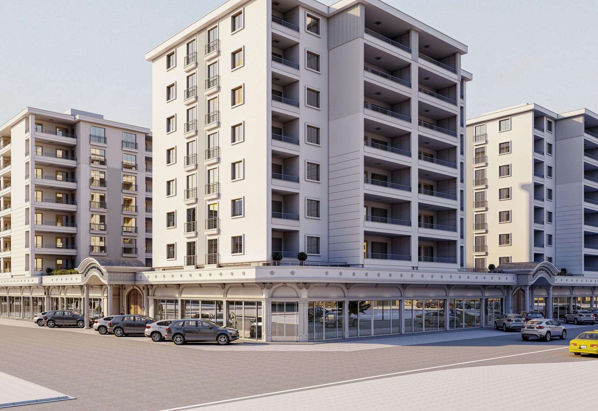 Fațadă de clădire comercială și rezidențială decorată cu profiluri, pilaștri și coloane alb-gri din poliuretan