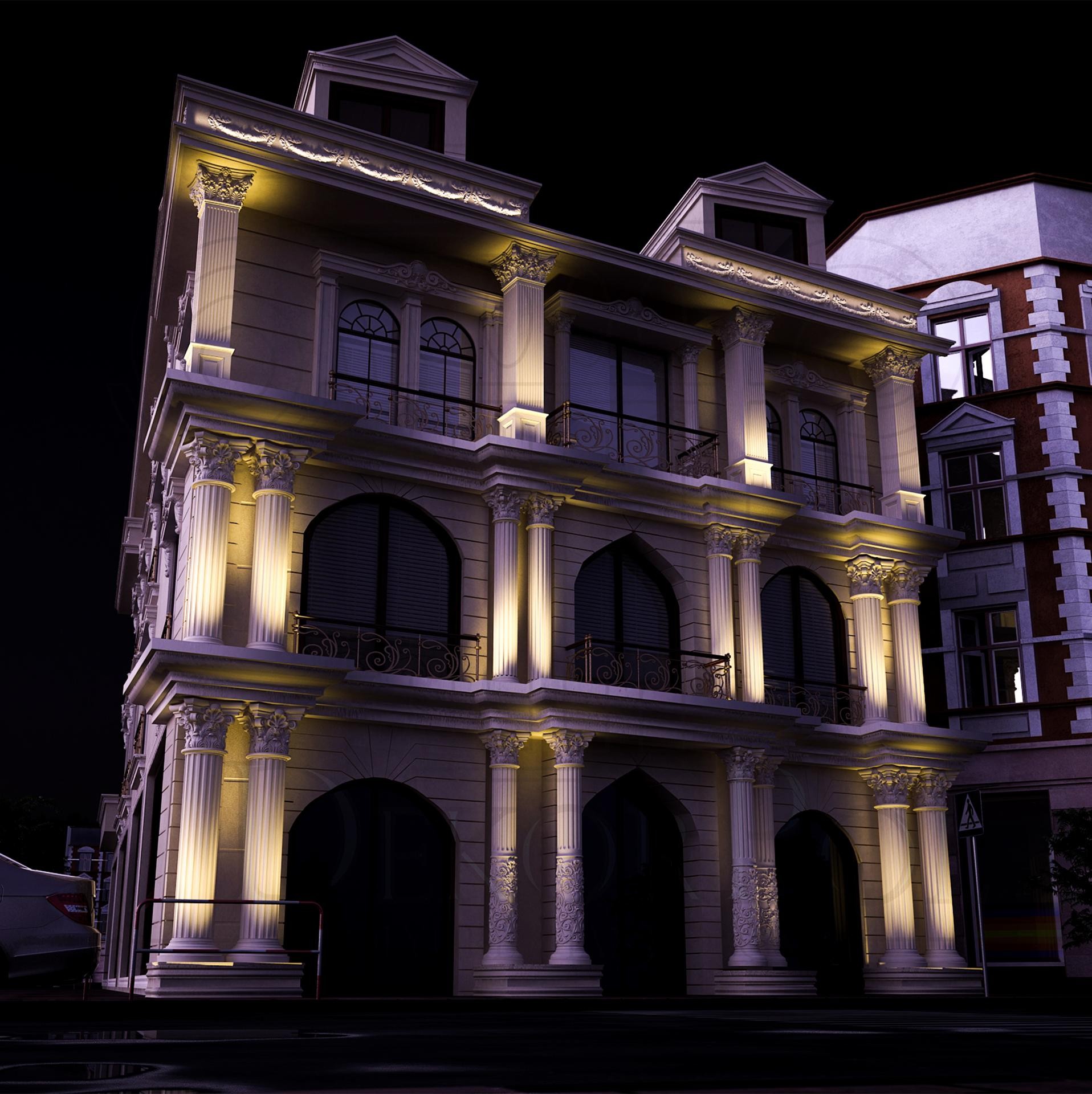Fațadă iluminată noaptea cu coloane din poliuretan, pilaștri canelați și ancadramente decorative clasice.