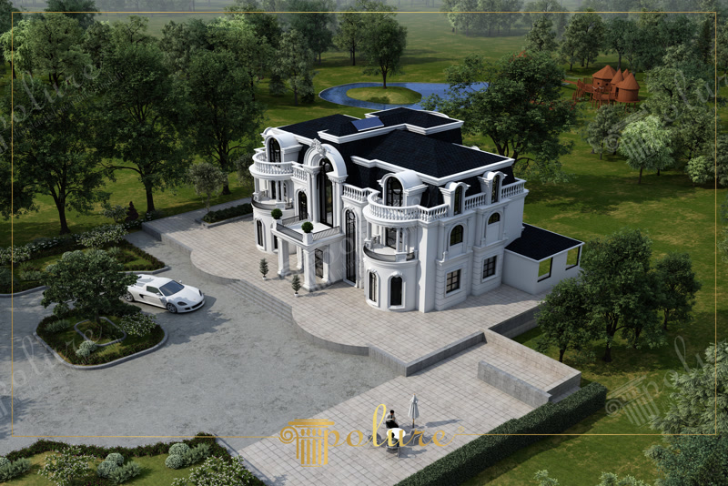 Fațadă de vilă clasică cu profiluri decorative albe din poliuretan și acoperiș negru mansardat.