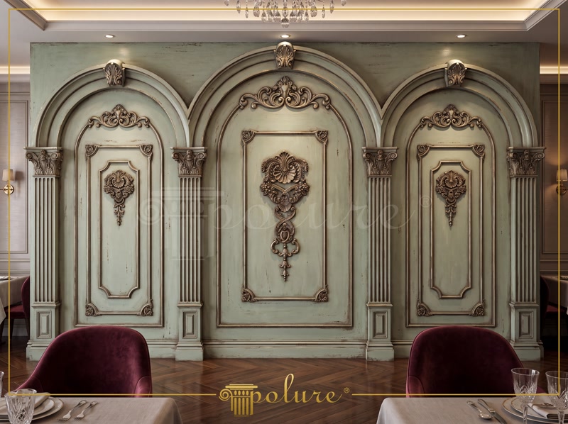 Decor de perete neoclasic verde cu arcuri din poliuretan, pilastri ornamentali și medalioane bronz patinat.